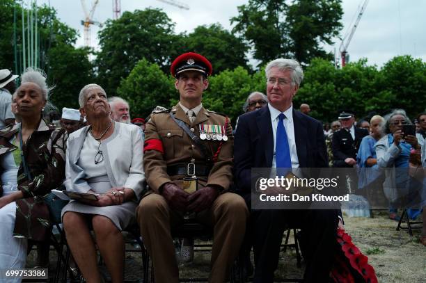 Members of the crowd and dignitaries including the Secretary of State for Defence Sir Michael Fallon watch as a memorial honoring the two million...