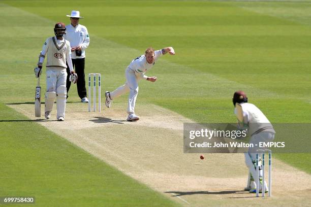 Durham's Ben Stokes bowls to Surrey's Steven Davies