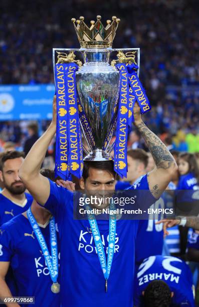 Leicester City's Leonardo Ulloa lifts the trophy as the team celebrate winning the Barclays Premier League, after the match at the King Power...