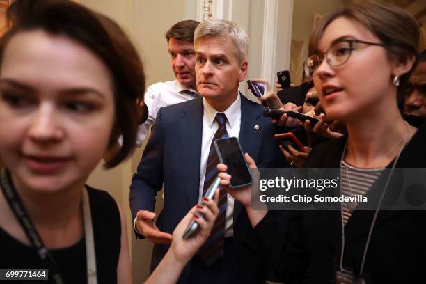 Sen. Bill Cassidy is surrounded by reporters as he leaves a meeting of GOP senators in the U.S. Capitol June 22, 2017 in Washington, DC. Most...