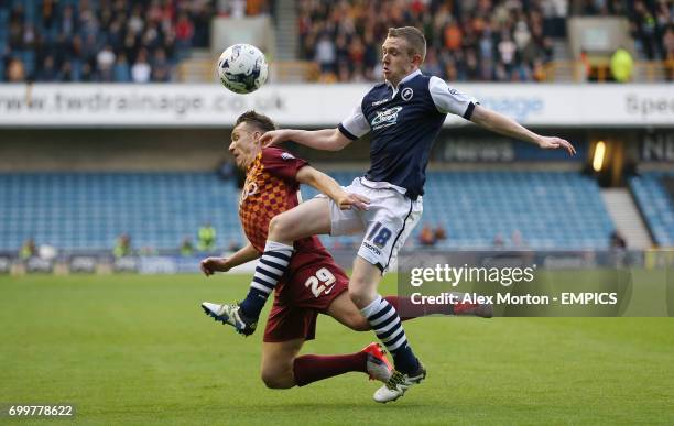 Millwall's Shane Ferguson and Bradford City's Tony McMahon battle for the ball