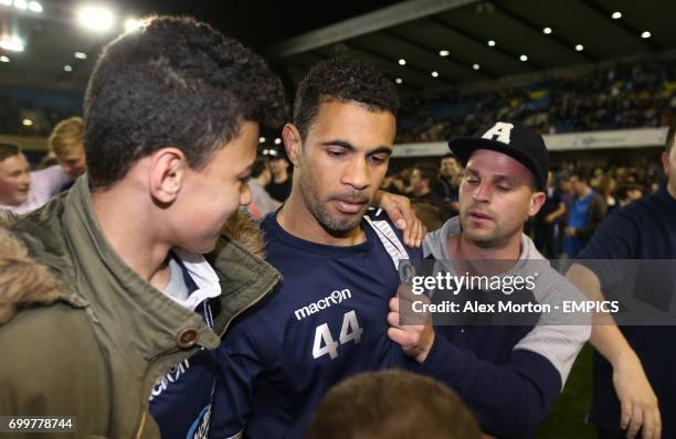 Millwall's Carlos Edwards with fans at the end of the match