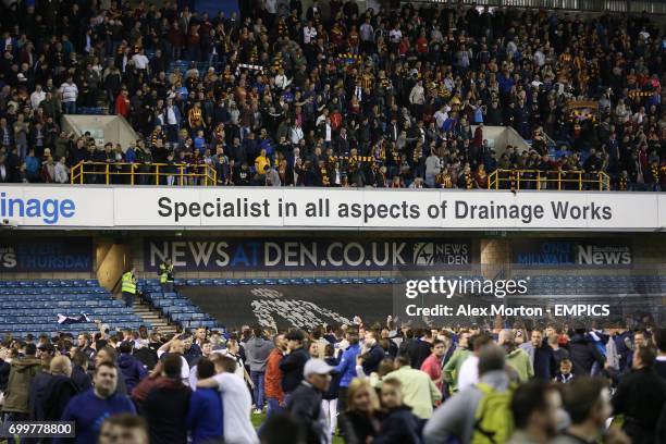 Millwall fans taunt Bradford fans at the end of the match