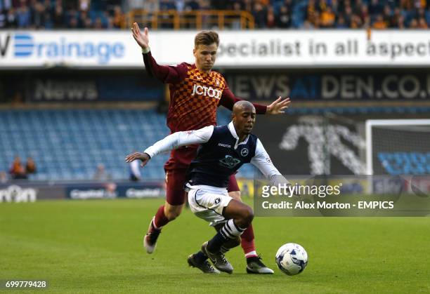Millwall's Nadjim Abdou and Bradford City's Lee Evans battle for the ball
