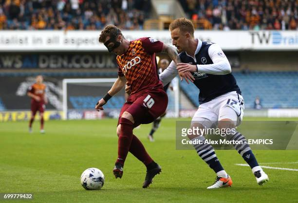 Bradford City's Billy Clarke and Millwall's Byron Webster in action