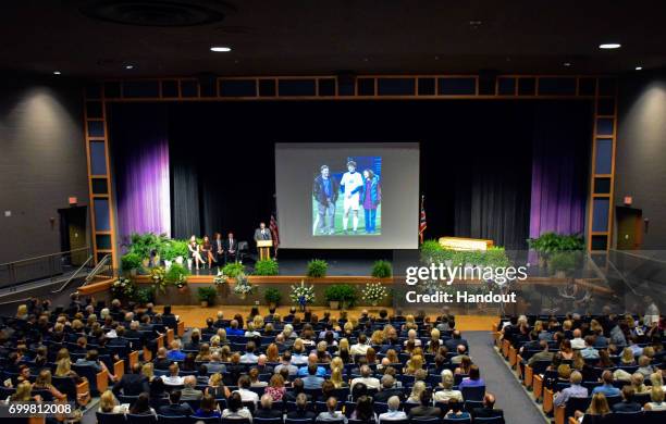 In this handout provided by The Warmbier Family, people attend the funeral service of Otto Warmbier at Wyoming High School June 22, 2017 in Wyoming,...