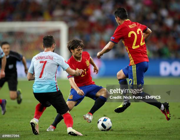 Spain's David Silva and Nolito in action with Turkey's Gokhan Gonul