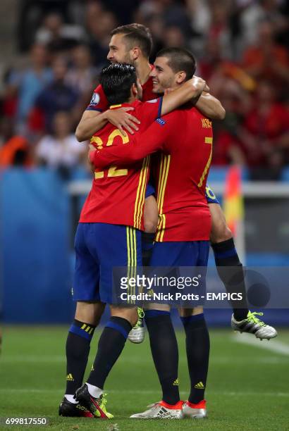 Spain's Alvaro Morata celebrates with his team-mates after scoring his side's third goal