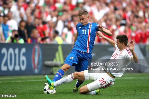Iceland's Alfred Finnbogason and Hungary's Richard Guzmics battle for the ball