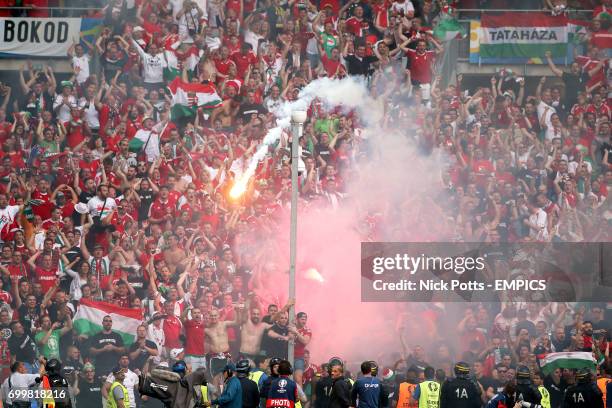 Flares are let off in the Hungary end of the stands as they celebrate a late equalising goal for their side