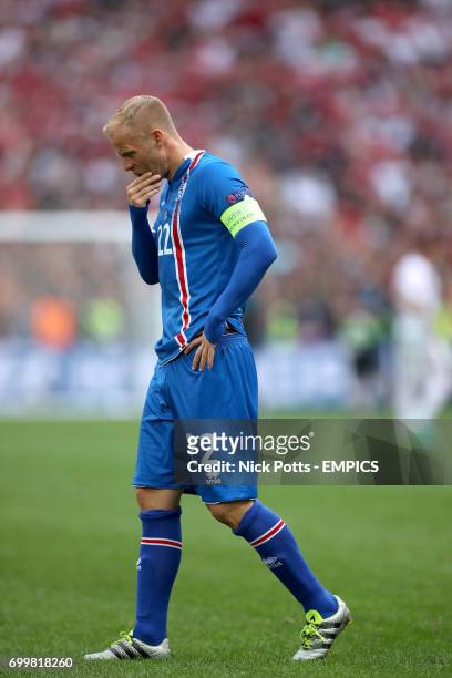 Iceland's Eidur Gudjohnsen stands dejected at the end of the game