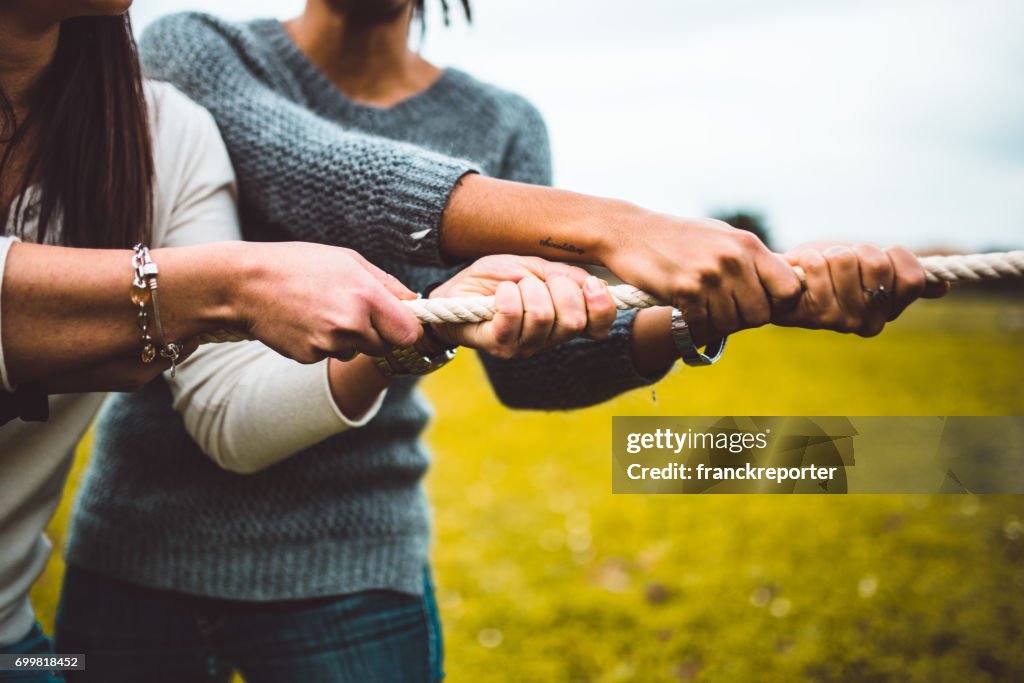 Friends enjoy the tug of war game