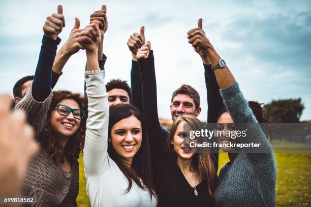happiness friends thumbs up for victory - democracy stock pictures, royalty-free photos & images