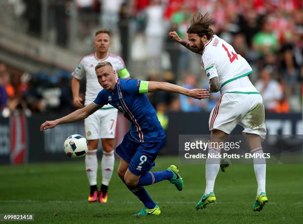 Iceland's Kolbeinn Sigthorsson and Hungary's Tamas Kadar battle for the ball