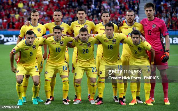 Romania team pose for a photograph before kick-off