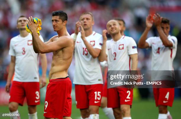 Poland's Robert Lewandowski applauds the fans after the final whistle