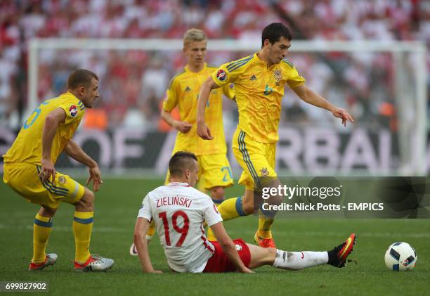 Poland's Piotr Zielinski and Ukraine's Taras Stepanenko battle for the ball