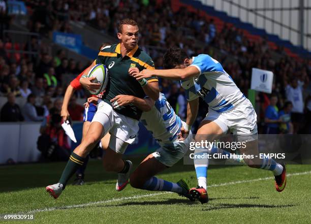 Argentina's Lautaro Bazan Velez tackles South Africa's Curwin Bosch.