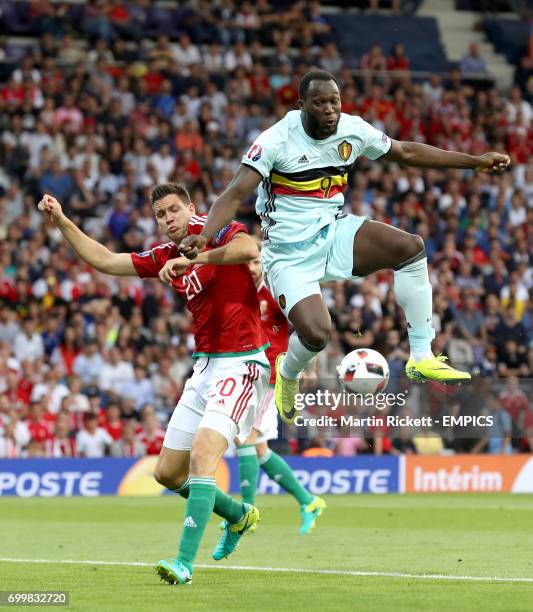 Hungary's Richard Guzmics and Belgium's Romelu Lukaku battle for the ball in the air