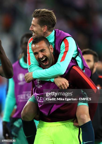 Portugal goalkeeper Eduardo celebrates with Adrien Silva