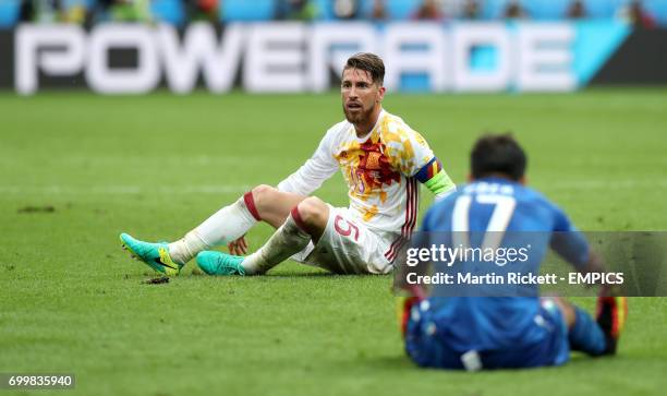 Spain's Sergio Ramos sits dejected