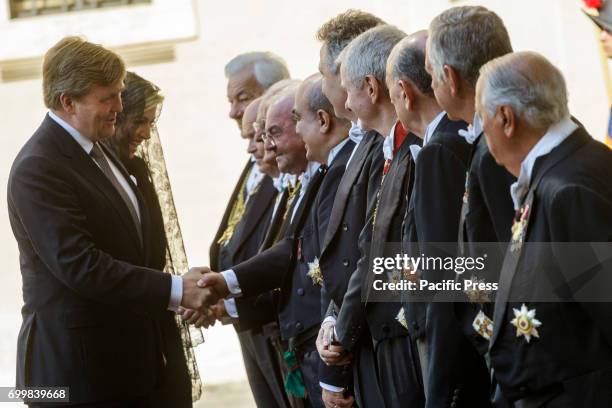 King Willem Alexander and the Queen Maxima of the Netherlands greet Vatican members of staff, called 'Gentiluomini' at the Apostolic Palace as they...