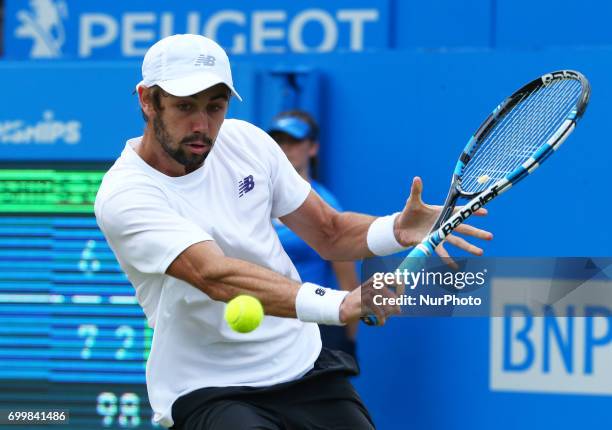 Jordan Thompson against Sam Querrey during Men's Singles Round Two match on the fourth day of the ATP Aegon Championships at the Queen's Club in west...