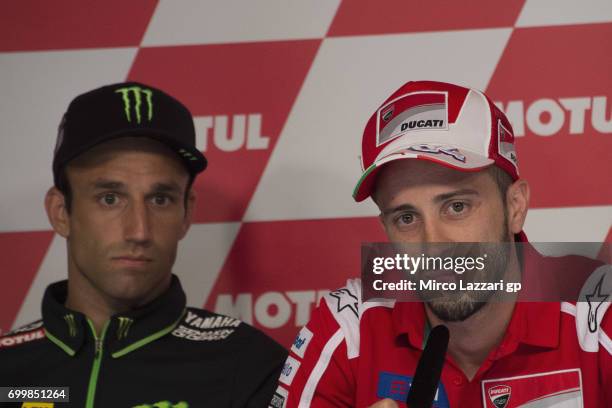 Johann Zarco of France and Monster Yamaha Tech 3 and Andrea Dovizioso of Italy and Ducati Team look on during the press conference pre-event during...