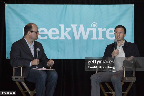 Dave Finocchio, co-founder and chief executive officer of Bleacher Report Inc., right, speaks as Todd Bishop, editor and co-founder of GeekWire LLC,...