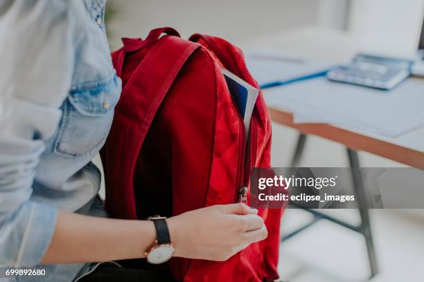 little student looking fore something in her backpack - open backpack stock pictures, royalty-free photos & images