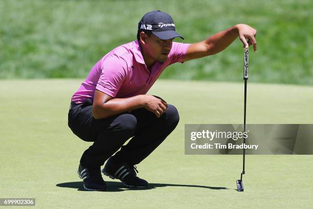 Fabian Gomez of Argentina lines up a putt on the ninth green during the first round of the Travelers Championship at TPC River Highlands on June 22,...