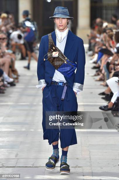 Model walks the runway at the Louis Vuitton Spring Summer 2018 fashion show during Paris Menswear Fashion Week on June 22, 2017 in Paris, France.