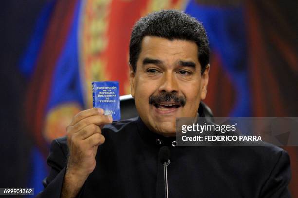 Venezuelan President Nicolas Maduro speaks during a press conference for foreign correspondents at the Miraflores presidential palace in Caracas on...