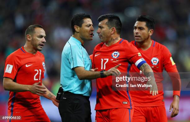 Gary Medel of Chile argues with Referee Alireza Faghani during the FIFA Confederations Cup Russia 2017 Group B match between Germany and Chile at...