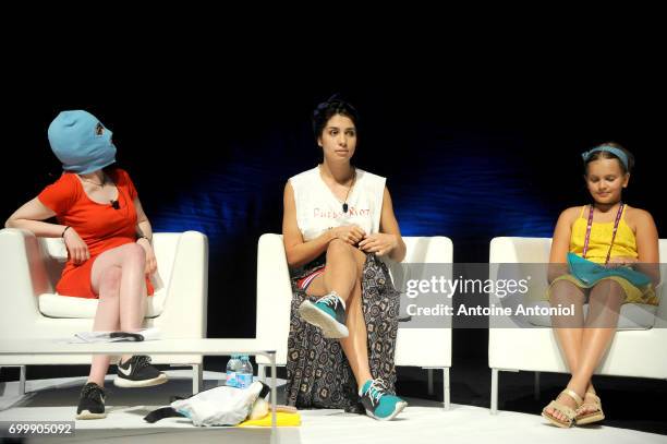 Masked member of protest band Pussy Riot, Pussy Riot performer Nadya Tolokonnikova and her daughter Gera Verzilova attend the Cannes Lions Festival...