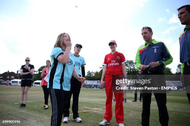 The match day mascot tosses a coin before the match to determine who bats first