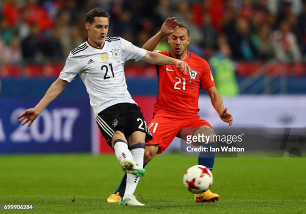 Sebastian Rudy of Germanyis put under pressure from Marcelo Diaz of Chile during the FIFA Confederations Cup Russia 2017 Group B match between...