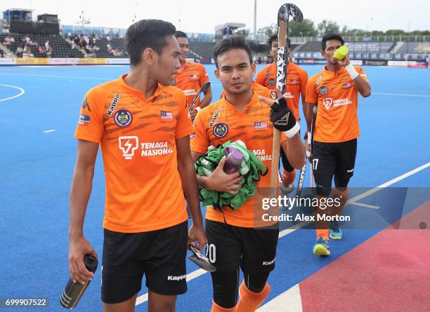 Haziq Samsul of Malaysia and Azuan Hasan of Malaysia celebrate after the quarter final match between India and Malaysia on day seven of the Hero...