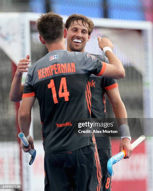 Bjorn Kellerman of the Netherlands celebrates scoring his teams fifth goal with teammate Robbert Kemperman during the quarter final match between the...