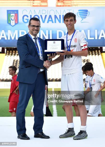 Lorenzo Schievano of Calcio Padova receives the second-placed license plate after the U16 Lega Pro Final match between Calcio Padova and FC Como on...