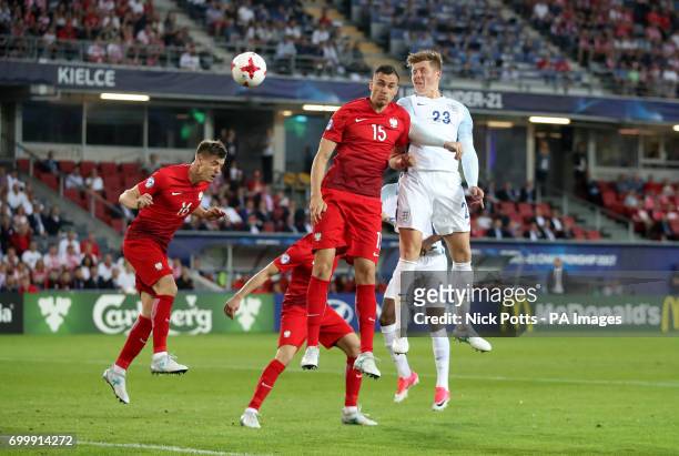 England's Alfie Mawson and Poland's Jaroslaw Jach battle for the ball during the UEFA European Under-21 Championship, Group A match at the Kolporter...