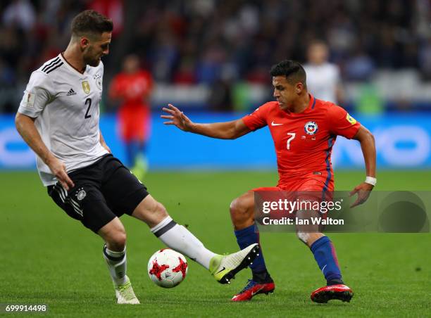 Shkodran Mustafi of Germany and Alexis Sanchez of Chile battle for possession during the FIFA Confederations Cup Russia 2017 Group B match between...