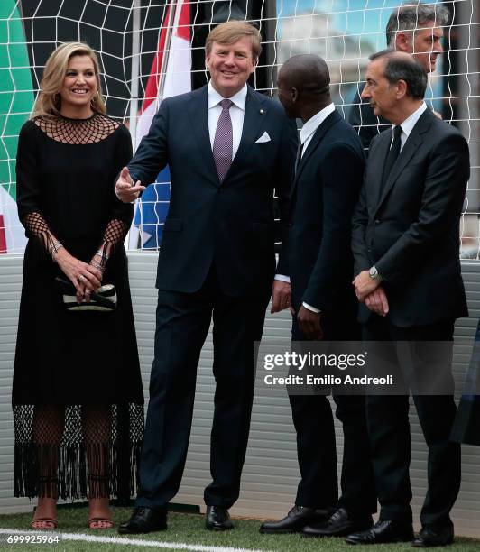 King Willem-Alexander of the Netherlands Queen Maxima of the Netherlands , Clarence Seedorf and mayor of Milan Giuseppe Sala attend a football clinic...