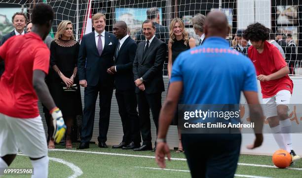 King Willem-Alexander of the Netherlands, Queen Maxima of the Netherlands, Clarence Seedorf and mayor of Milan Giuseppe Sala attend a football clinic...