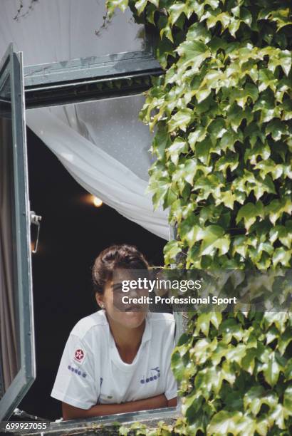 American tennis player Jennifer Capriati pictured looking out of a window at the All England Tennis Club during progress to reach the semifinals of...