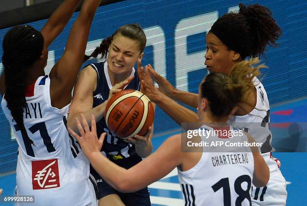 Valeriane Ayayi and Alexia Chartereau of France try to block Barbora Balintova of Slovakia during the FIBA EuroBasket 2017 women's quarterfinal match...