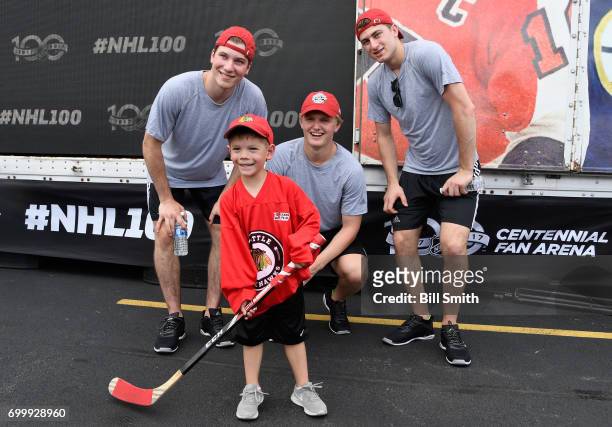 Top draft prospects Nolan Patrick, Casey Mittelstadt and Gabriel Vilardi pose with a young hockey player during the Top Prospects Hockey Clinic at...