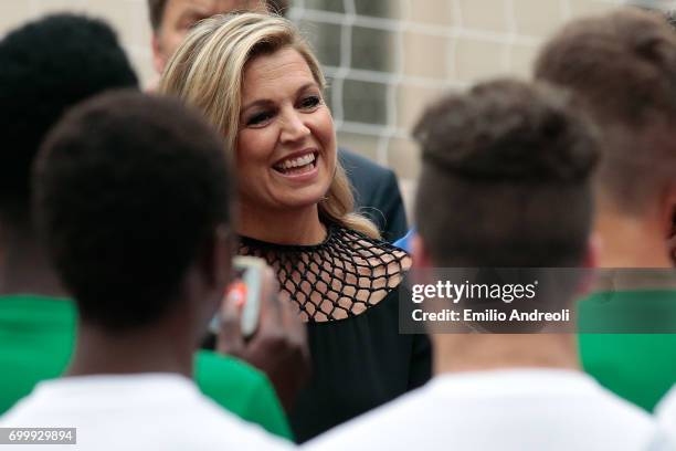 Queen Maxima of the Netherlands smiles during a football clinic for integration organized by Italian Football Federation on June 22, 2017 in Milan,...