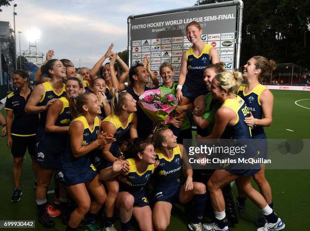 Georgia Nanscawen is lifted up onto the shoulders of team mates as she celebrates winning her 200th cap after the FINTRO Women's Hockey World League...