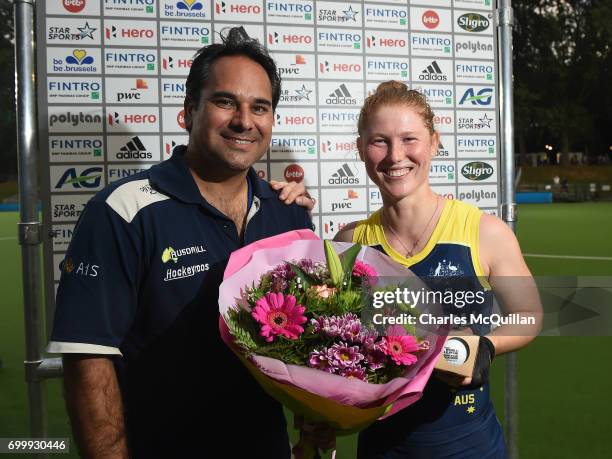 Georgia Nanscawen is presented with a bouquet of flowers as she celebrates winning her 200th cap after the FINTRO Women's Hockey World League...